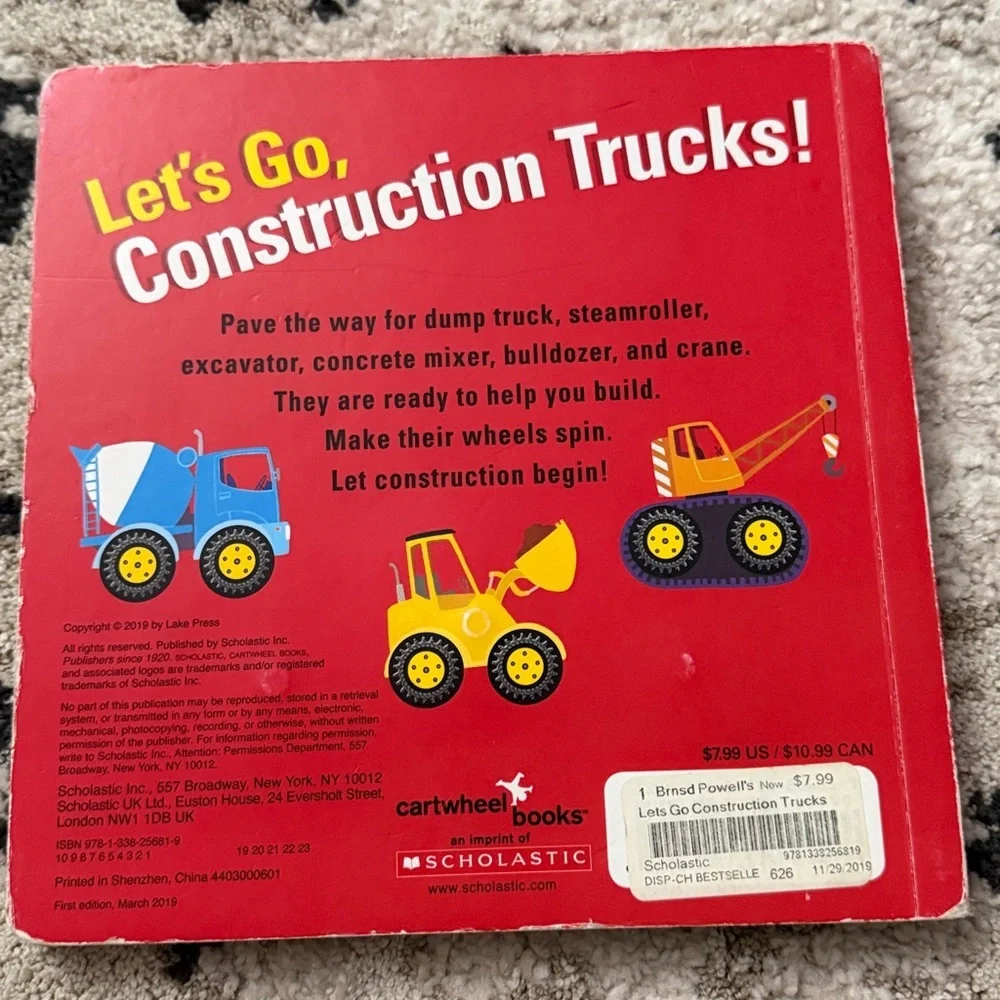 Scholastic Let's Go, Construction Trucks! Board Book - Yellow Truck on Red Cover